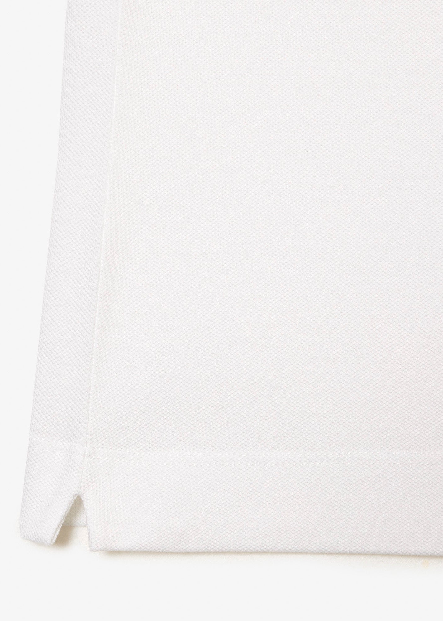 Polo Paris manches longues Lacoste blanc